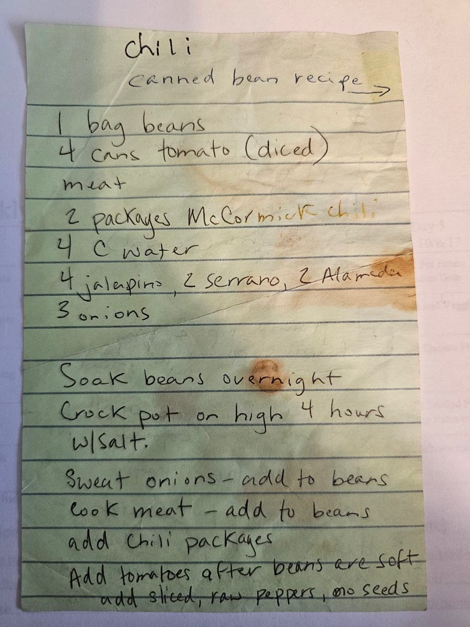 Front of the stained green sticky note